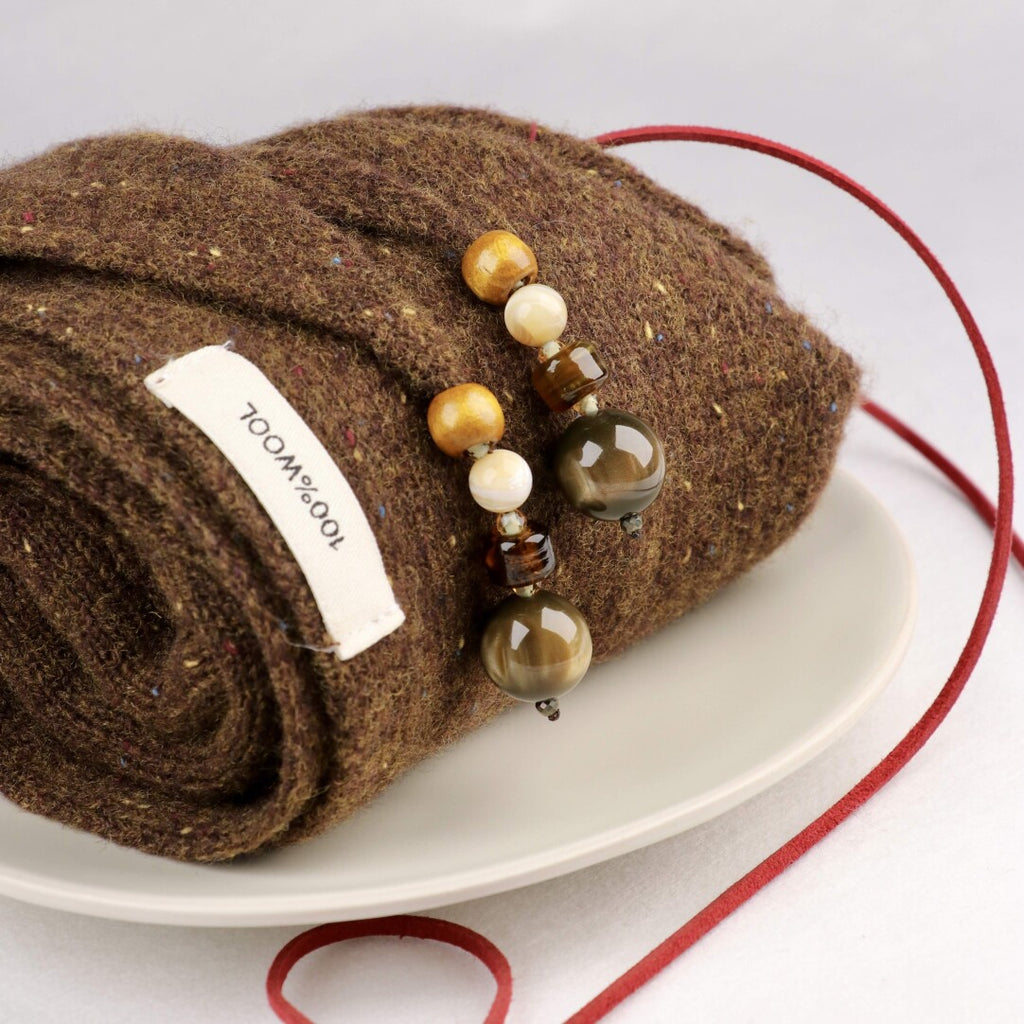 Woven Warmth Hand‑Knitted Wool Triangle Scarf,Lumivault.